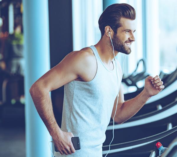 Man Running On Treadmill